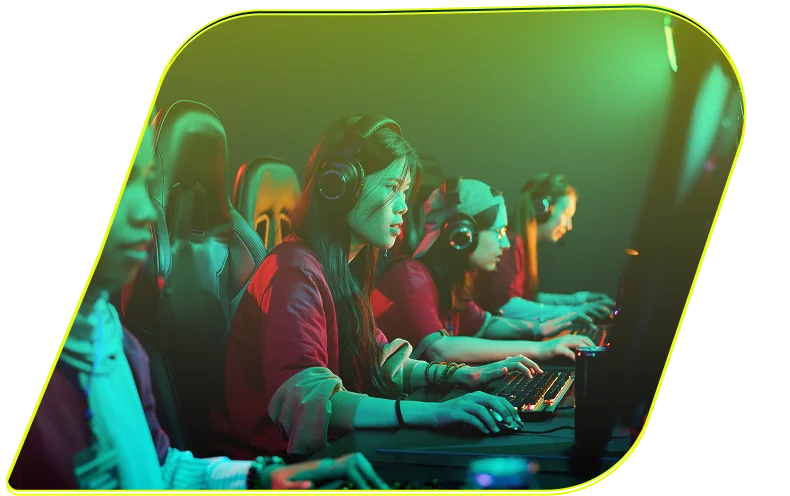 A diverse group of focused female gamers wearing headsets competes in an esports tournament, their faces illuminated by glowing screens and colorful lights.